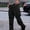 Black, variant on Men's Outdoor Cargo Pants Elastic Waist with Pockets and Zippered Utility Design for Sporting Activities