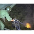 thumbnail image 2 of Vietnam War. Us Air Force Helicopter Door Gunner Fires A Mini-Gun During A Rescue Patrol Over South Vietnam. Oct. 10, 2 of 2