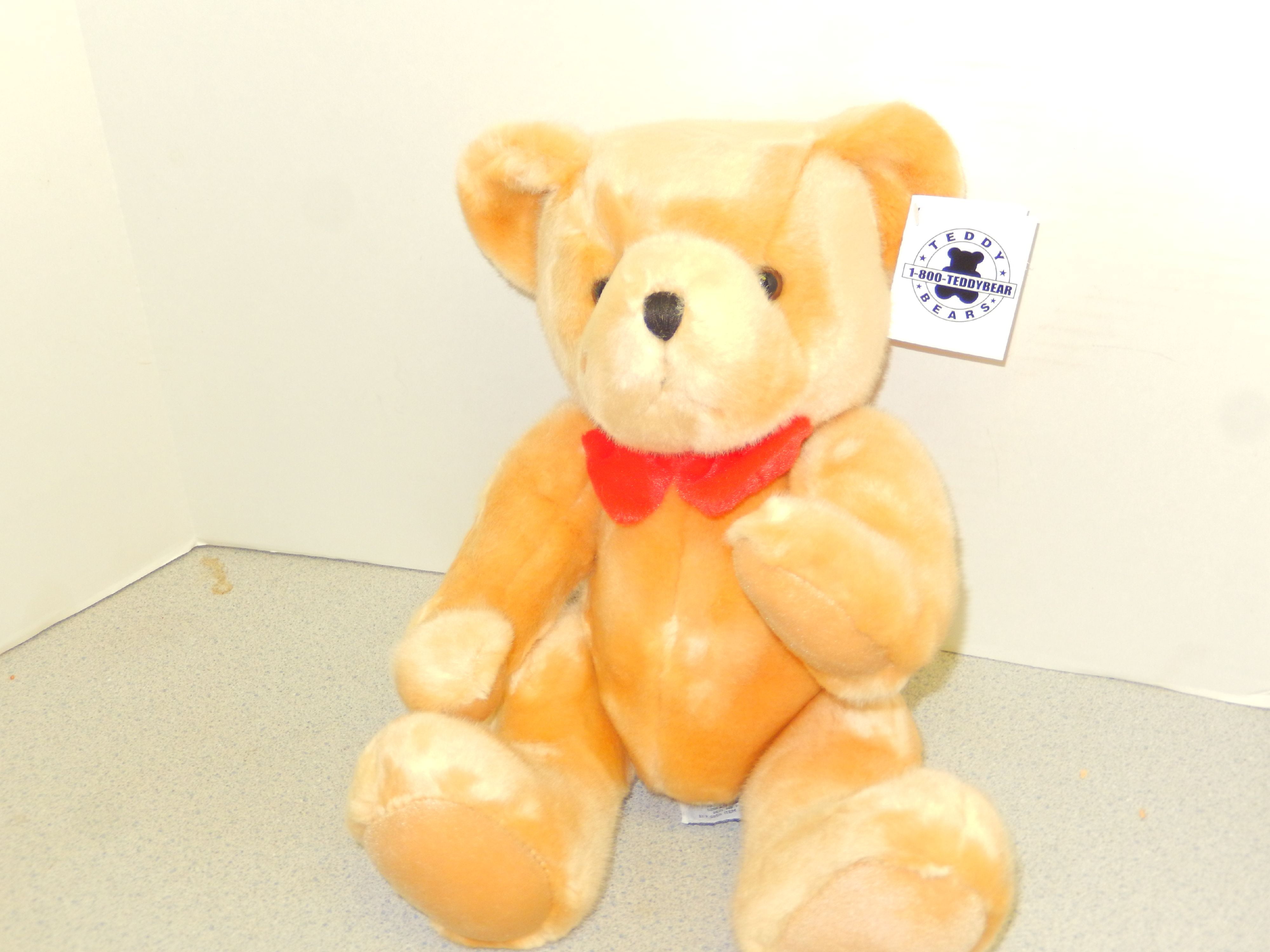 teddy bear with red bow