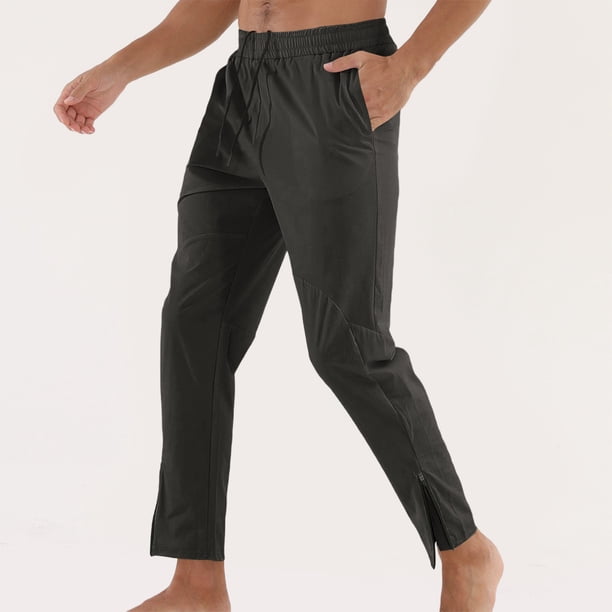 Pantalones deportivos casuales de color liso de moda para hombre, largos y con puños con cremallera.