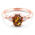 thumbnail image 2 of Gem Stone King 18K Rose Gold Plated Silver Orange Red Madeira Citrine and White Moissanite 3-Stone Rings for Women (1.18 Cttw, Gemstone, Oval 8X6MM, Available in Size 5, 6, 7, 8, 9), 2 of 5
