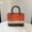 orange, variant on KUNPENG Plastic Woven Easter Wedding Gift Basket with Handle, Portable Shower Caddy for Bathroom Storage, Rattan Style Grocery Tote & Picnic Basket for Snacks, Washable Handbag for Gifts, 10"x6"x8"