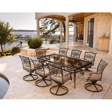 Hanover Outdoor Traditions 9-Piece Dining Set with 42 x 84 Glass-Top Table and 8 Swivel Rockers