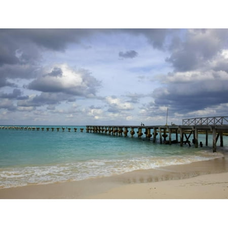 Jetty on Cancun Beach, with Grey Clouds Overhead Print Wall Art By Sean