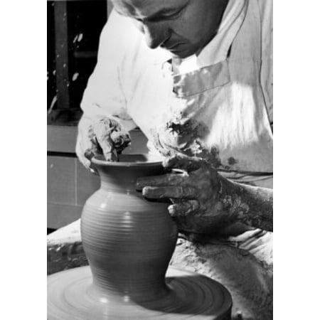 Potter working on a pottery wheel Canvas Art - (18 x 24)