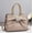 f199Khaki, variant on Women's Glossy Khaki Patent Leather Tote Bag with Bow & Rhinestone Detail, Gold-Tone Braided Handles, Convertible Crossbody Strap