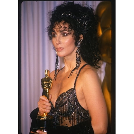 Cher In The Press Room Just After Receiving Her Oscar For Best Actress In Moonstruck While Wearing A Bob Mackie