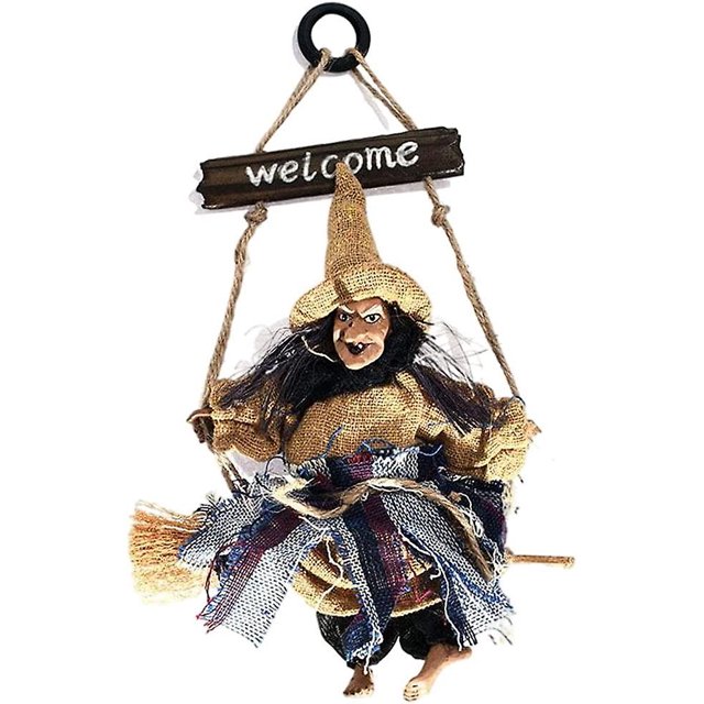 Señal de bienvenida con colgante de bruja, accesorios para casas embrujadas y sombrero amarillo.