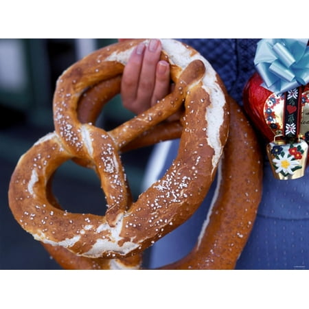 Woman in Blue German Costume Holding Two Large Pretzels Print Wall