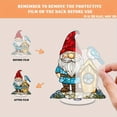 thumbnail image 3 of Rotatable acrylic ornament featuring a stained glass gnome in red hat and turquoise shirt next to a birdhouse with a blue bird on top, 3 of 8