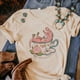 thumbnail image 2 of Camiseta de dinosaurio para mujer, camiseta de diseñador de anime japonés, ropa urbana femenina, ropa de anime de los años 2000, 2 of 5