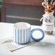 thumbnail image 2 of Ounissouiy Taza de agua de cerámica con patrón de rayas, taza de café con leche con asa, vasos para bebidas, botella para el hogar, dormitorio interior Utensilios de cocina Azul blanco Ounissouiy HA081898-03, 2 of 6
