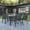 Black, variant on Emma + Oliver Five Piece Patio Table Set with 31.5" x 55" Metal Table with Tempered Glass Top and 4 Brown Flex Comfort Stacking Chairs