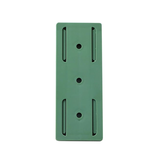 Retenedor de enchufe Montado en la pared Punch Free Home Toma de corriente Fixer Holder Green