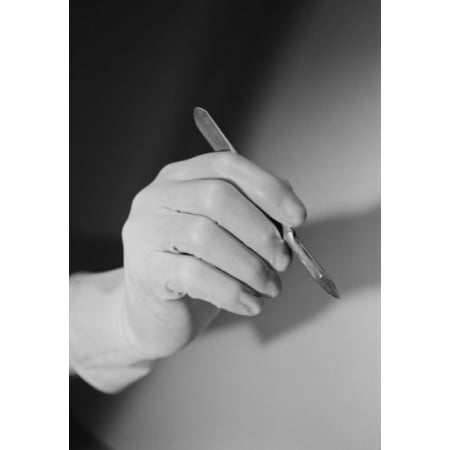 Hand holding scalpel Canvas Art - (18 x 24)