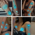 thumbnail image 5 of Pegatinas de tatuajes de neón con luces negras para fiestas luminosas, tatuajes temporales luminosos azules, 12 hojas, joyas ultravioleta, tatuajes falsos para la piel con brillo corporal, 5 of 5