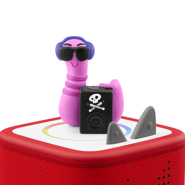 tonies Story Pirates Audio Play Figurine in multicolour, featuring a purple character with blue ears holding a black speaker with a white skull and crossed pencils design, placed on a red and white Toniebox with grey ears, designed for educational electronics and screen-free kids' entertainment.