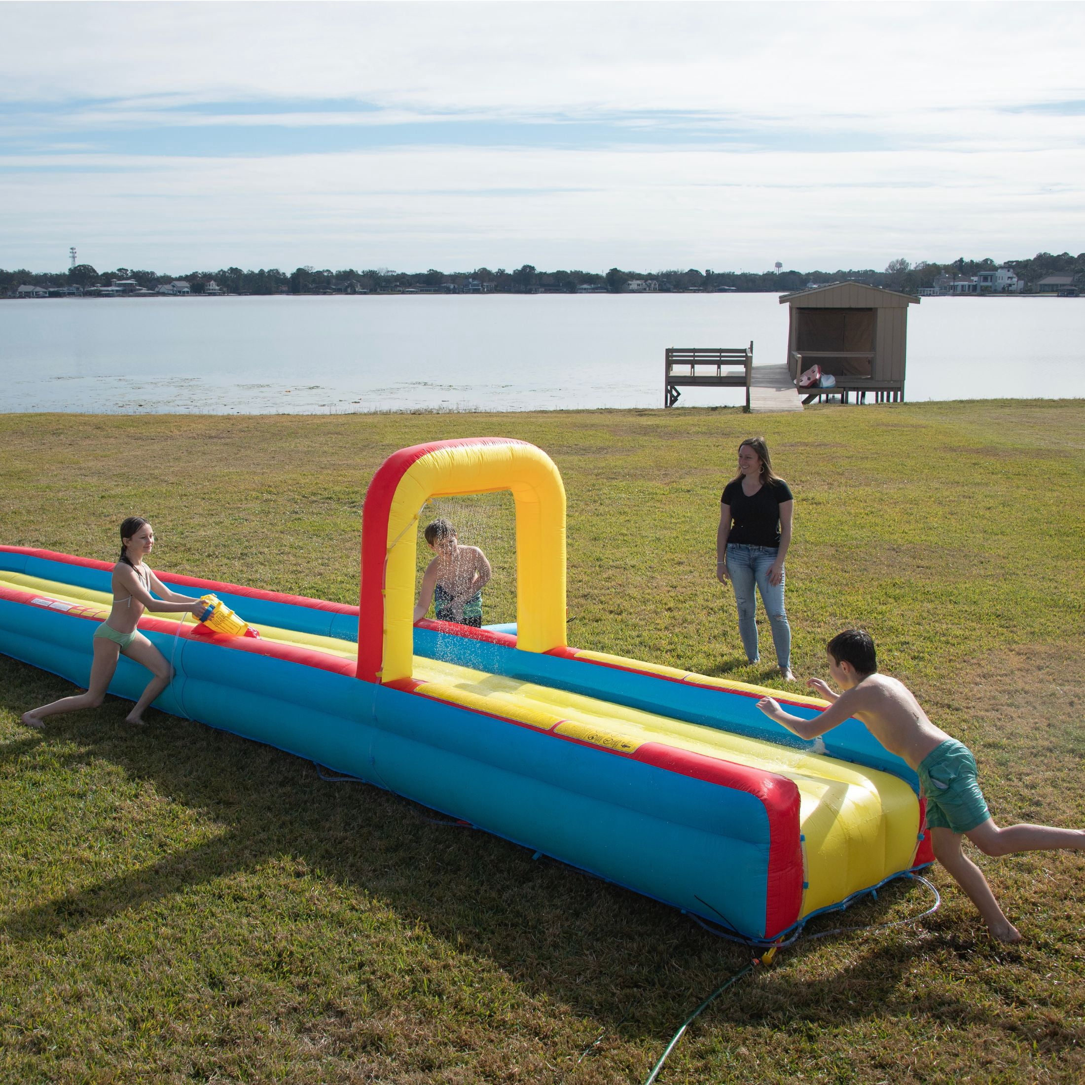 Wham-O 30-Foot Constant Air Slip N Slide Inflatable Water Slide with Blower, Air-Cushioned Track, Waterfall Splash, Water Cannon, Ages 5-12, 1-Count