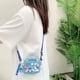 thumbnail image 2 of Cartera con correa ajustable, cremallera y dije para niñas, inspirada en Lilo y Stitch., 2 of 7