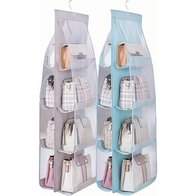 wm 2 packs de organizador de bolsos para colgar, soporte para monederos de armario, organizador de armario con 8 bolsillos de fácil acceso, 41 l x 13,5 w (b gris azul) Par de organizadores colgantes, vista 3/4 frontal, cada unidad muestra cuatro ventanas transparentes por lado (8 bolsillos en total), fabricado en fibra de poliéster mezclada con PVC, gancho de acero inoxidable para varilla de closet y diseño plegable para guardado. Adecuado para bolsos medianos, bandoleras y accesorios; también suele usarse para guardar toallas o suéteres en estantes compactos.