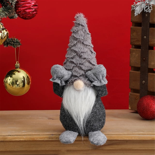 adornos navideños wmkox8yii muñeco anciano sin rostro 26x12,5 cm figura gris de 26 x 12.5 cm con cuerpo de tela no tejida, barba blanca larga de fibra sintética, nariz redonda de fieltro claro y gorro puntiagudo texturizado; manos levantadas y pies en tela a juego, colocado sobre mesa frente a fondo rojo con esferas colgantes. Adorno de Navidad y adorno de ventana adecuado para decorar mesa y espacios festivos.