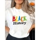 thumbnail image 1 of Comodidad para el día a día] Camiseta gráfica colorida "I AM BLACK HISTORY" para mujer - Cuello redondo, manga corta, cómoda mezcla de algodón, ideal para el verano | Estilo informal | Ajuste cómodo, 1 of 6
