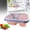 Pink, variant on Yooci grey Silicone Foldable Lunch Box on Table, Space-saving Leak-proof Versatile Collapsible Bento Box