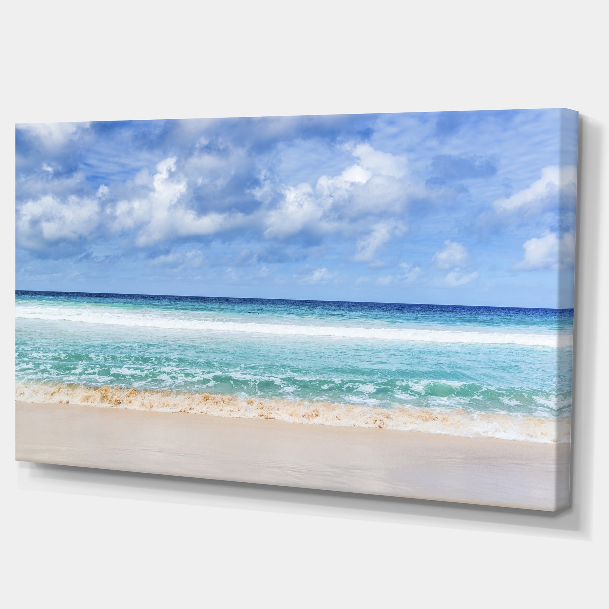Designart 'Tranquil Beach under White Clouds ' Modern Seascape Canvas Artwork