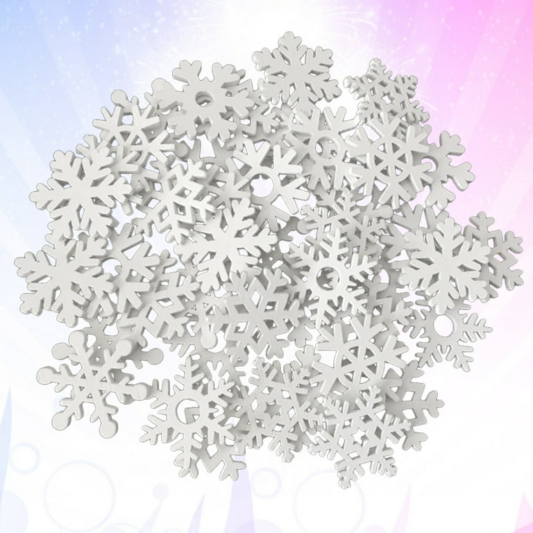 white snowflakes on wooden background. christmas decoration