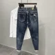 thumbnail image 4 of Pantalones vaqueros rasgados con estampado para hombre, pantalones con agujeros gráficos rotos, pantalones casuales suaves Kpop con estilo, pantalones vaqueros holgados góticos regulares para hombre, 4 of 4