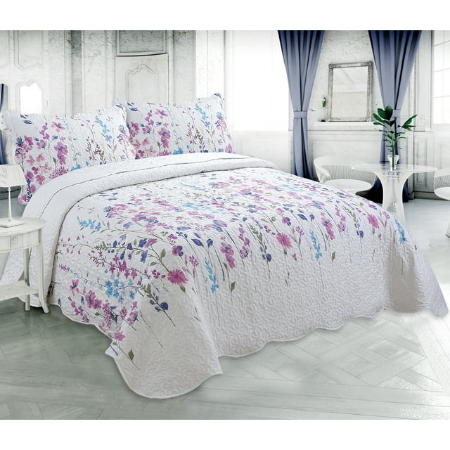 ultra soft summer quilt set featuring colorful floral garden print on white stitched coverlet and matching pillow shams in elegant bedroom setting