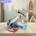 thumbnail image 6 of Rotating acrylic display showcasing a pelican skimming water with sandy shores and blue sea lavender in vibrant, detailed colors against a pure white background, 6 of 6