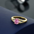 thumbnail image 4 of Gem Stone King 18K Yellow Gold Plated Silver Pink Moissanite and White Lab Grown Diamond 3 Stone Engagement Ring for Women | 1.46 Cttw | Oval 8X6MM | Round 2MM | Gemstone Birthstone | Size 6, 4 of 4