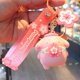 thumbnail image 1 of Sanrio-llavero de flor de cerezo de gatito Kawai, colgante de colección, Cinnamoroll Kawaii, Kuromi My Melody para decoración de bolsos de niña rosa, 1 of 5
