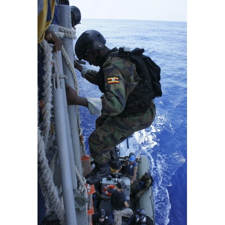 A marine from the Uganda Peoples Defense Force descends a US Navy ship Poster (Best Way To Ship To Uganda)
