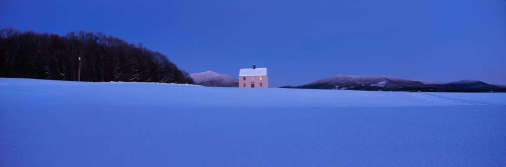 This is a single home all by itself It has no neighbors and sits alone in a field It is located on Darling Hill Road Mount Burke is seen in the background There is snow on the ground and it is a winte