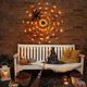 thumbnail image 3 of Telaraña de 60 LED, 3,25 pies de diámetro, ilumina la telaraña, decoración de Halloween, juguete de araña de peluche negro, luz naranja impermeable a batería para decoración de paredes en interiores y, 3 of 5