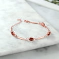 thumbnail image 3 of Gem Stone King 18K Rose Gold Plated Silver Red Garnet and White Zirconia Tennis Bracelet for Women | 3.72 Cttw | Gemstone January Birthstone | Oval 7X5MM | 6 inch + 1 inch Extender, 3 of 3