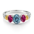 thumbnail image 2 of Gem Stone King 925 Sterling Silver and 10K Yellow Gold Oval Persian Blue Moissanite Red Created Ruby and White Diamond 3 Stone Ring for Women (2.41 Cttw, Gemstone Birthstone, Size 7), 2 of 3