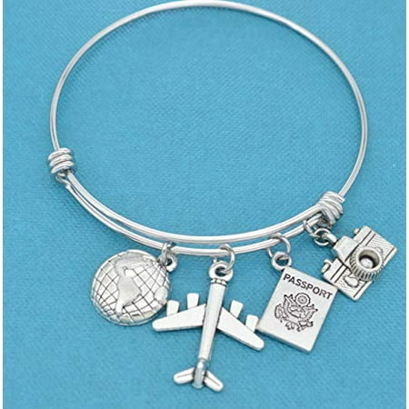 - World traveler bangle bracelet in stainless steel with earth, airplane, passport and camera charms in silver tones. Gift for traveler.