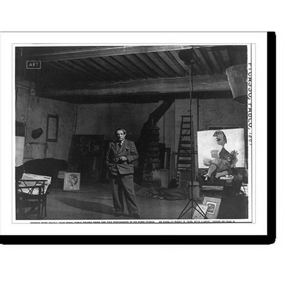 Historic Print, Dressed more neatly than usual, Pablo Picasso posed for this photograph in his Paris studio. On easel at right is girl with a cock"", 16" x 20"