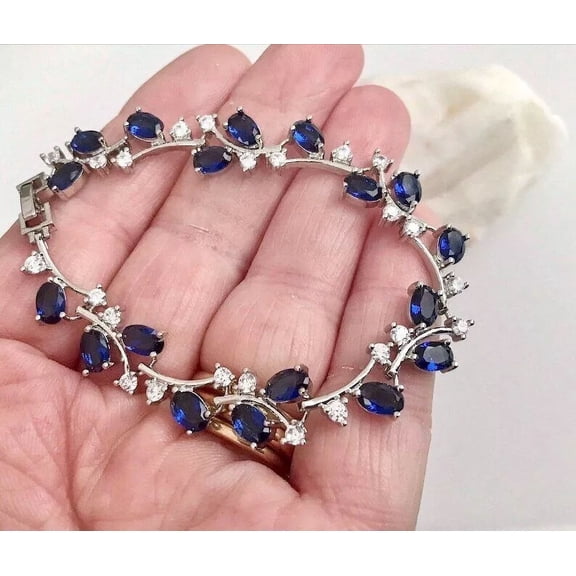 8Ct Oval Simulated Blue Sapphire Women's Tennis Bracelet in 14K White Gold Plated
