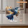 thumbnail image 4 of Rotating acrylic ornament featuring a stunning blue and gold hummingbird with intricate stained glass details on a white background, designed for elegance, 4 of 7