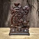 thumbnail image 3 of Ebony wood carving, symbolizing harmony and prosperity, is a solid wood decorative item for living room, entryway, and TV cabinet, representing good fortune when moving to a new home., 3 of 3