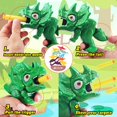 thumbnail image 2 of Toy Gun Fuzzy Pixie, paquete de 2 lanzadores de dardos con forma de dinosaurio, 10,5 m, 2 of 9