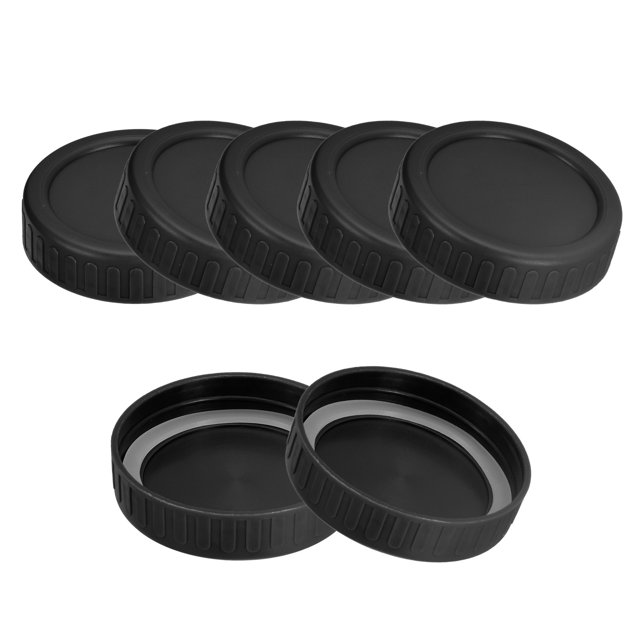 Unique Bargains Mason Jar Lids, 10 pack Plastic Storage Lids with 10pcs Silicone Ring, Regular Mouth (Black). The image shows a set of black plastic Mason jar lids with ribbed edges for an anti-slip grip. Two lids are displayed open, revealing the silicone rings for creating an airtight seal. Designed to fit standard 70mm Mason jars, these reusable and durable lids are ideal for food storage, meal prep, and canning.