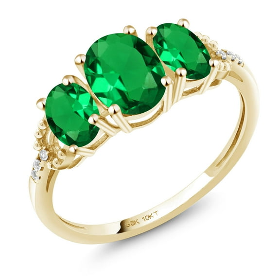 Gem Stone King 10K Yellow Gold Green Simulated Emerald and Diamond Accent 3-Stone Engagement Ring | 1.42 Cttw | Oval 7X5MM & 6X4MM | Three Stone Wedding Anniversary Gold Ring for Women (Size 7)