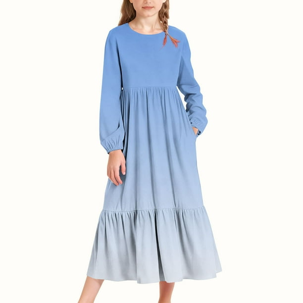 Vestido infantil de poliéster de manga larga, cuello redondo, bolsillos laterales y falda larga.