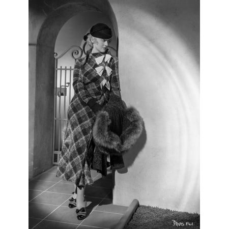 Bette Davis Leaning on the Corner Holding a Black Fur Boa in Black Hat and Tartan Long Sleeve Dress Photo Print