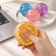 thumbnail image 3 of Coconut Oil Squishy with shiny flower and star sequins, Coconut Oil Slow Rising Squeeze Stress Ball Clear Jelly Bubblegum Texture Coconut Oil Squishy Toy,Orange, 3 of 4